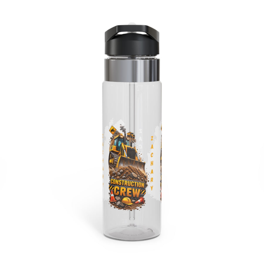 Clear plastic water bottle with a black flip lid and a straw, printed with a yellow bulldozer above the words Construction Crew, a hard hat and cones, and the name Zachary reading downwards.