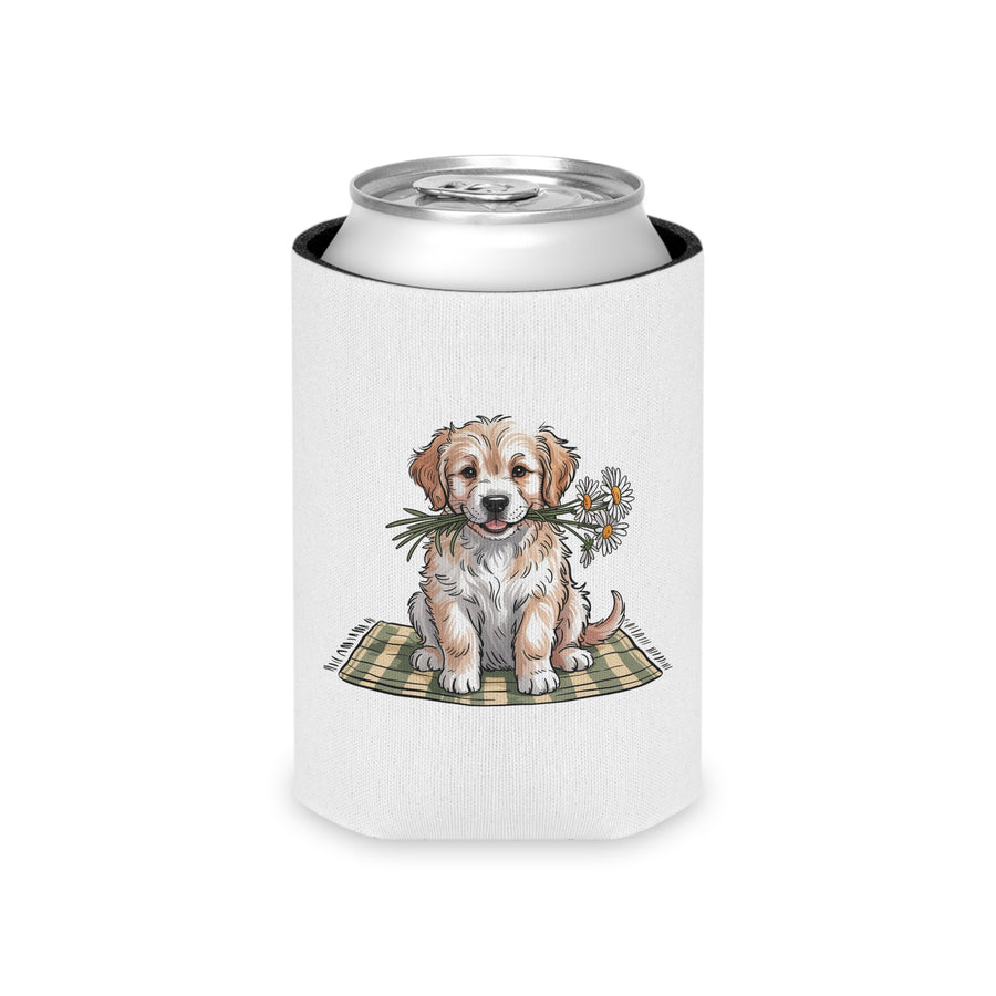 A white can cooler on a drink can, printed with a fluffy golden and cream puppy sitting on a green plaid blanket, holding white daisies in its mouth.
