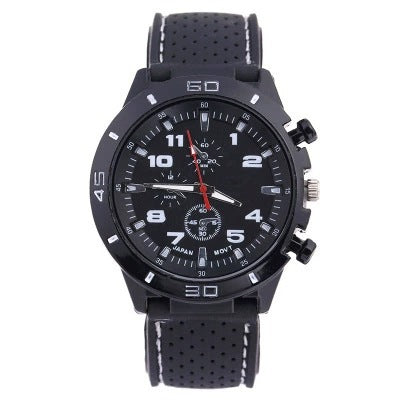 Black watch with red accents, chronograph-style dial and a perforated black silicone strap with red stripe