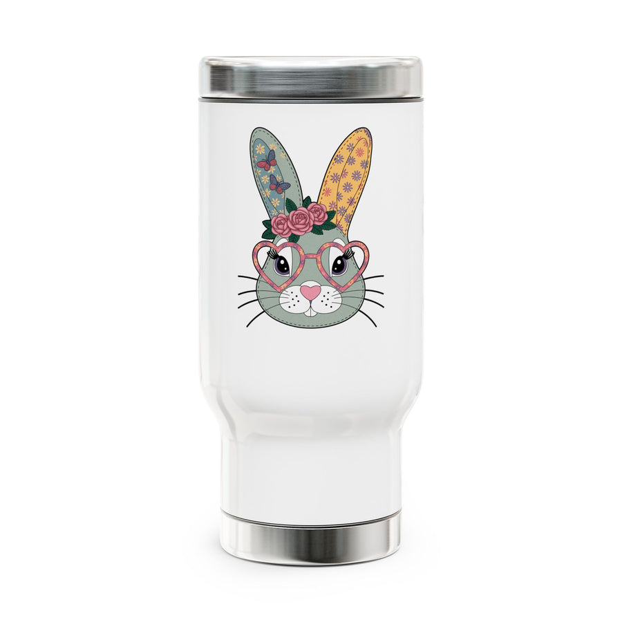A white stainless steel travel mug with a silver lid and base, printed with a cute gray-green bunny face wearing pink heart-shaped glasses and a crown of pink roses, with butterfly and flower patterned ears.