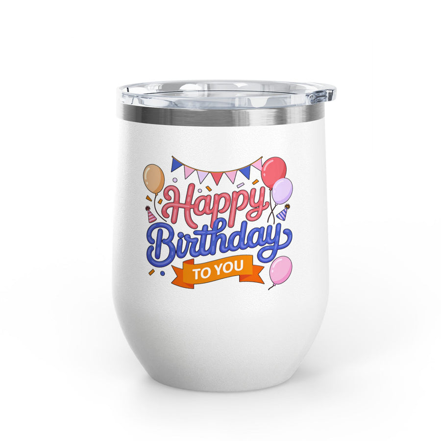 A white stainless steel stemless wine tumbler with a clear push-on lid, printed with "Happy Birthday" in pink and blue script under party bunting, with balloons, party hats and an orange "TO YOU" banner.