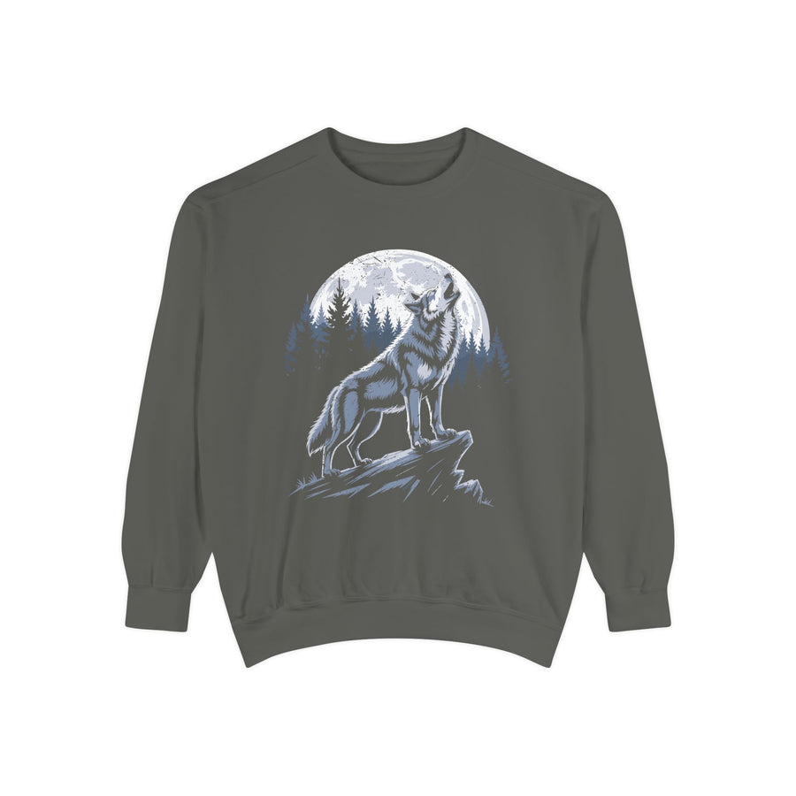 A blue crewneck sweatshirt printed with a white wolf howling in front of a full moon and a pine forest.