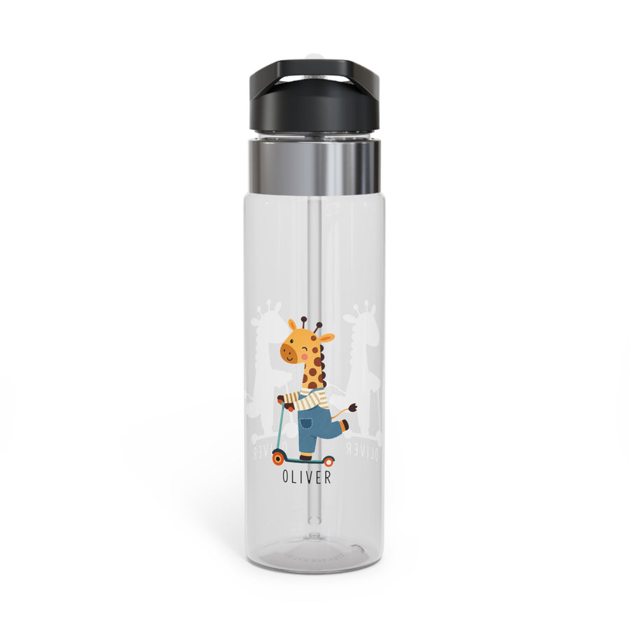 A clear water bottle with a black lid and straw, printed with a cartoon giraffe riding a scooter and the name "Oliver" in black text, on a desk with toys.