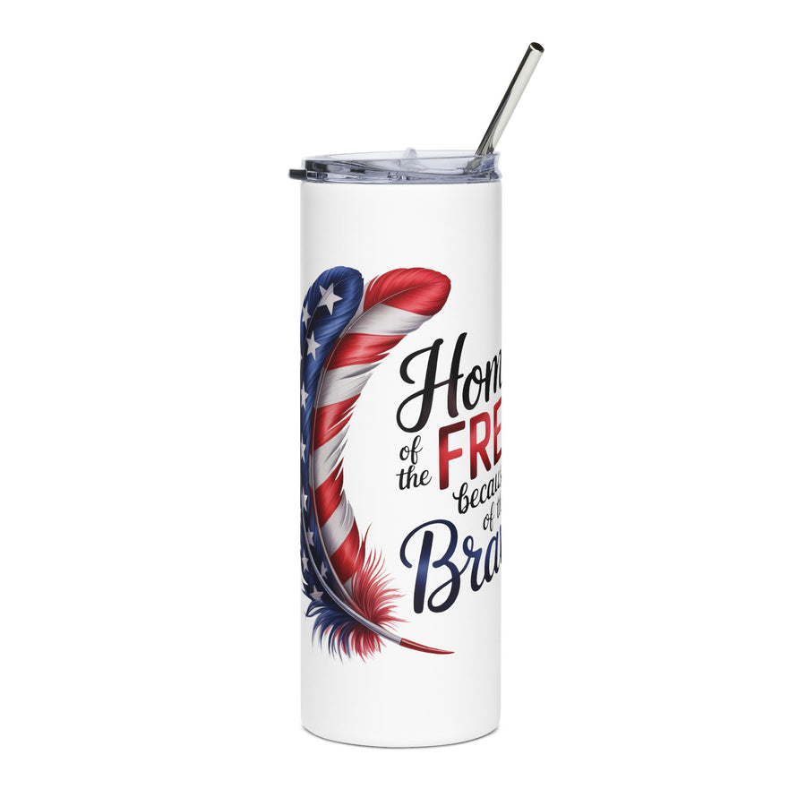 A white stainless steel skinny tumbler with a clear lid and metal straw, printed with a stars-and-stripes feather beside the words "Home of the FREE because of the Brave."