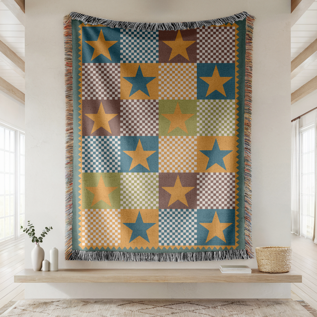 Fringed woven blanket pieced from checkerboard squares in teal, ochre, brown and sage, each square carrying a single large five-pointed star, set inside a gold zigzag border.