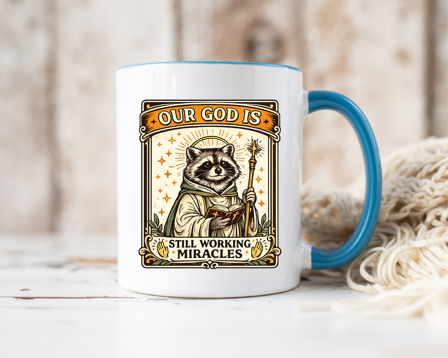 Our God Is Still Working Miracles Coffee Mug, Funny Raccoon Christian Gift for Friends, Cute Religious Parody Trash Panda Ceramic Tea Cup with Black Handle