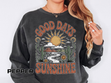 A dark gray crewneck sweatshirt printed with a retro desert scene of a sun, cacti and a winding road framed by the words Good Days Sunshine.