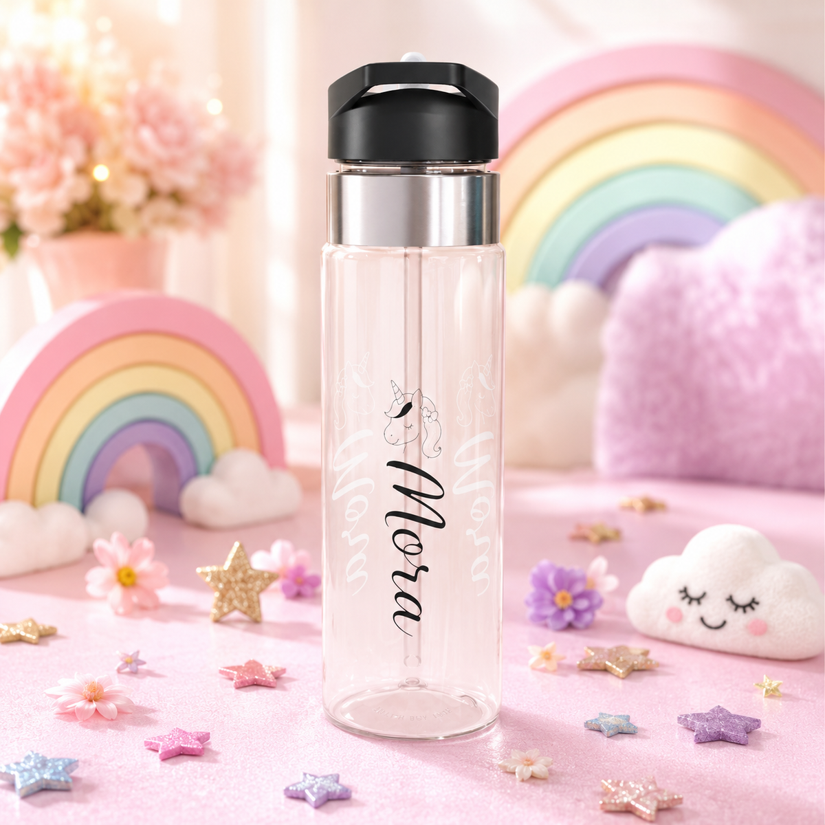 Clear plastic water bottle with a black flip lid and a straw, printed with a line-drawn unicorn head above the name Nora in black script, the name repeated faintly in white behind it.