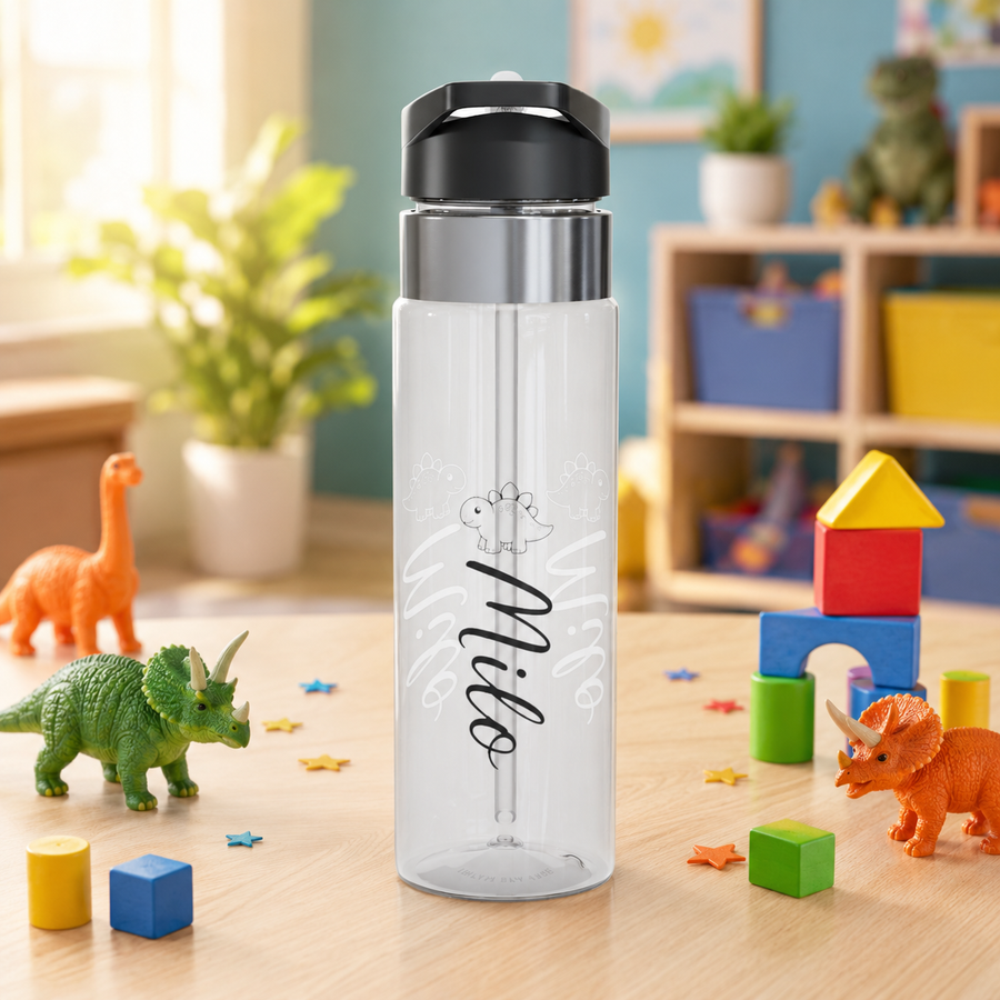 Clear plastic water bottle with a black flip lid and a straw, printed with a line-drawn stegosaurus above the name Milo in black script, the name repeated faintly in white behind it.