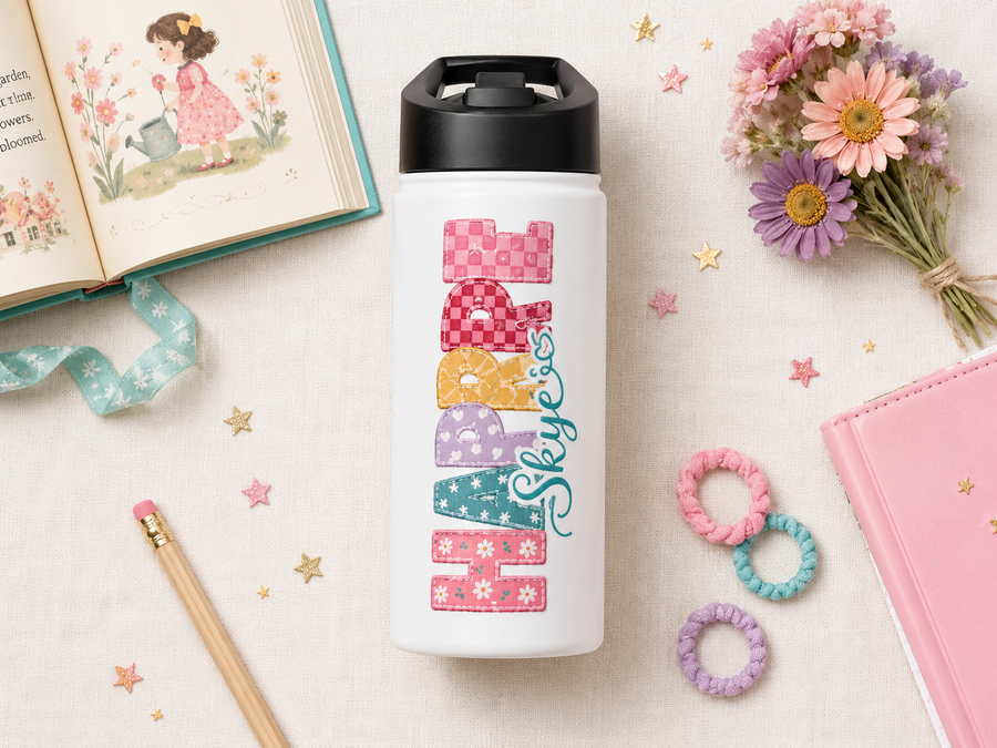 White water bottle with a black lid, printed with the word Happy reading downwards in patchwork applique letters of checks and florals, with the name Skye in teal script beside it.