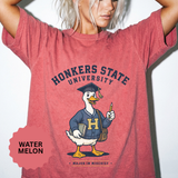 A red T-shirt printed with a goose in a graduation cap and varsity sweater holding a pencil under Honkers State University and Major in Mischief.