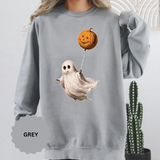 A gray crewneck sweatshirt printed with a vintage-style ghost floating while holding a jack-o'-lantern balloon.