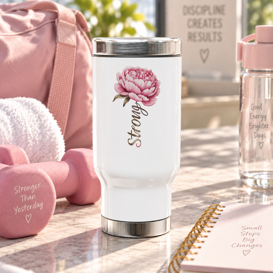 White stainless steel travel mug printed with a pink peony flower and the word 'Strong' in cursive script.