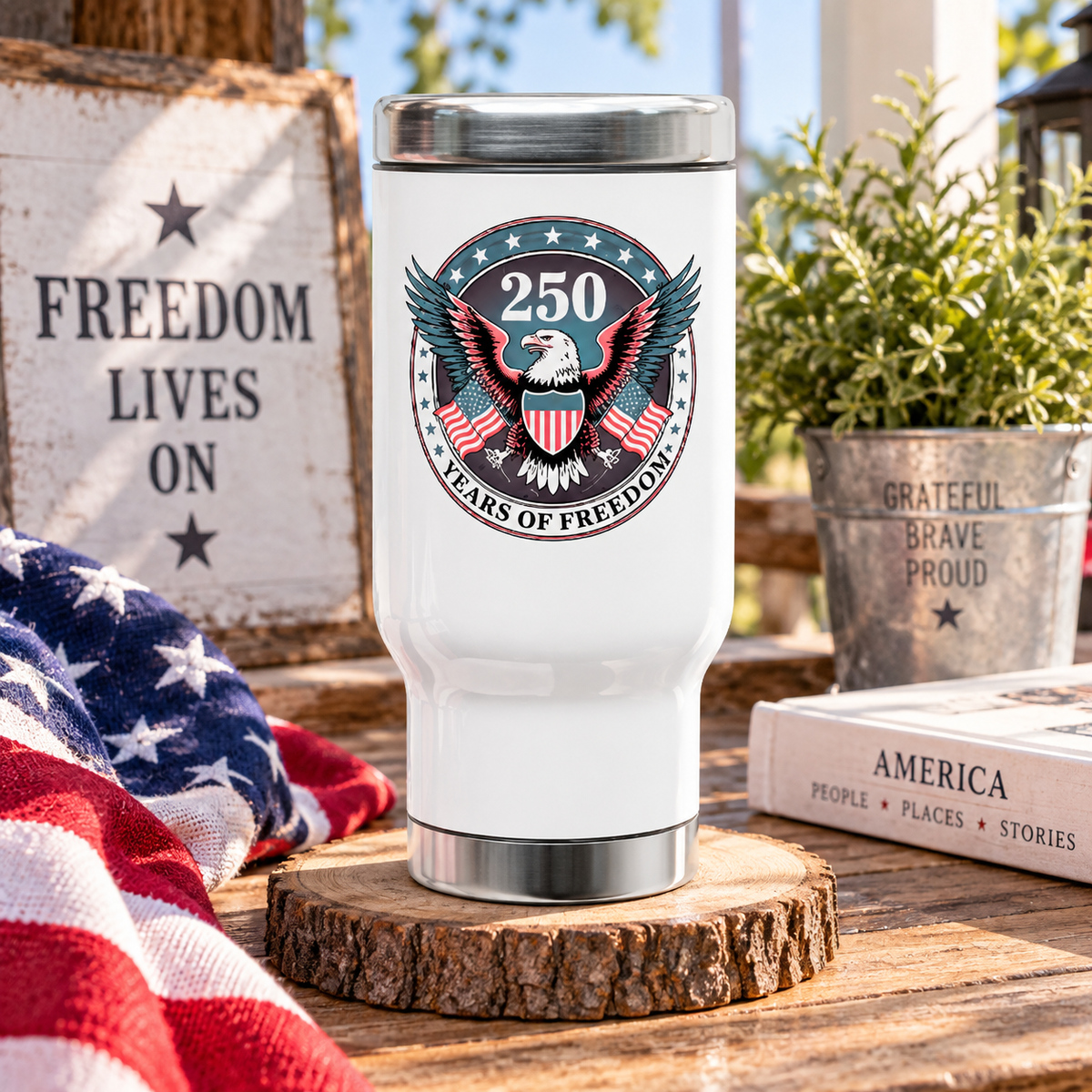White stainless steel travel mug printed with an eagle emblem and a circular badge reading '250 Years of Freedom' with crossed American flags.