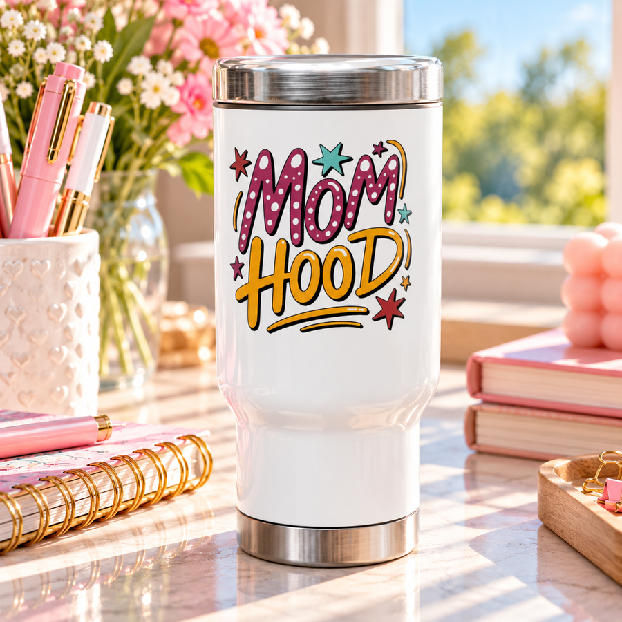 A white stainless steel travel mug with a silver lid and base, printed with "MOM HOOD" in pink polka-dot and yellow lettering with scattered stars.