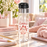 A clear water bottle with a black flip-top lid, stainless band and straw, printed with the sample name "Emma" in pink above a cartoon bunny wearing a pink bow, surrounded by small hearts.