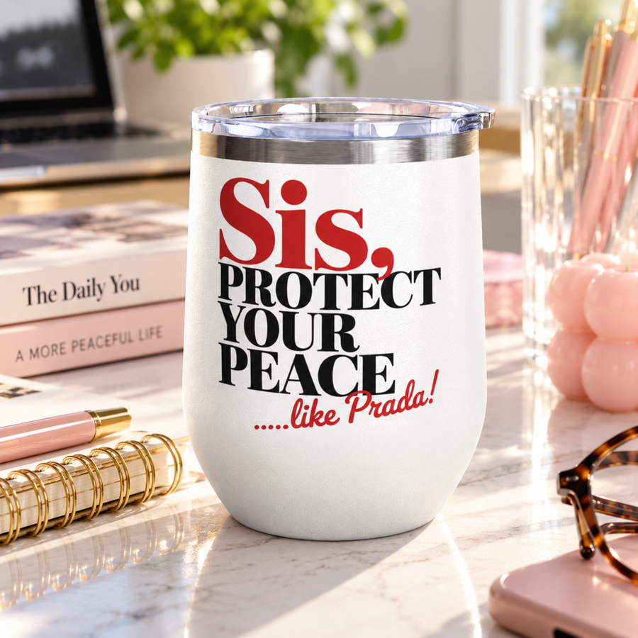 A white stainless steel stemless wine tumbler with a clear push-on lid, printed with "Sis, PROTECT YOUR PEACE" in bold red and black serif lettering with a short red script tagline.