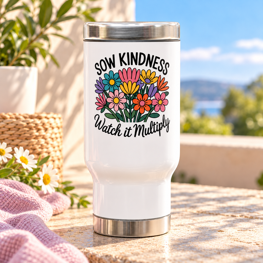 A white stainless steel travel mug with a silver lid and base, printed with "SOW KINDNESS" above a colorful bouquet of pink, yellow, purple, orange and teal wildflowers and "Watch it Multiply" in black script.