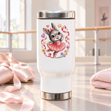A white stainless steel travel mug with a silver lid and base, printed with a cute gray bunny ballerina in a pink tutu and hair bow, dancing among pink ribbons, hearts, stars and small flowers.