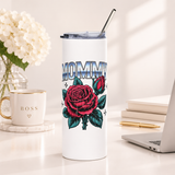 A white stainless steel skinny tumbler with a clear lid and metal straw, printed with "MOMMY" in chrome-style block lettering above a large pink rose and rosebud with teal leaves and small sparkles.