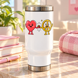 A white stainless steel travel mug with a silver lid and base, printed with a smiling cartoon red heart holding hands with a smiling yellow peace sign character, with small sparkles.