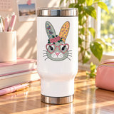 A white stainless steel travel mug with a silver lid and base, printed with a cute gray-green bunny face wearing pink heart-shaped glasses and a crown of pink roses, with butterfly and flower patterned ears.