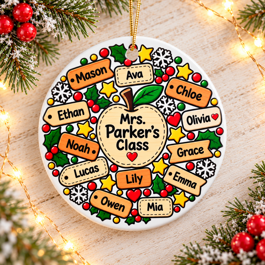 A round white ceramic Christmas ornament on a gold string, printed with a large apple reading a sample "Mrs. Parker's Class", ringed by orange and cream name tags with sample student names, holly, gold stars, snowflakes and red berries.