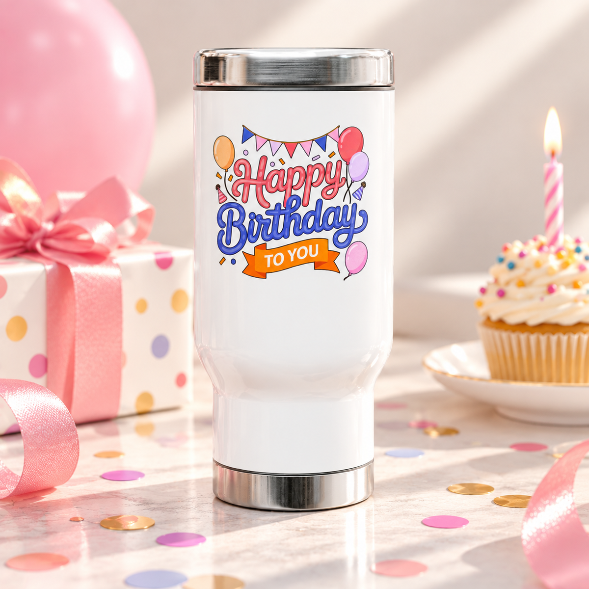 A white stainless steel travel mug with a silver lid and base, printed with "Happy Birthday" in pink and blue script under party bunting, with balloons, party hats and an orange "TO YOU" banner.