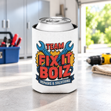 A white can cooler on a drink can, printed with "TEAM FIX IT BOIZ" in bold red lettering over crossed blue wrenches and yellow gears, above a "REPAIRS & SOLUTIONS" banner.