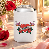 A white can cooler on a drink can, printed with a red heart wrapped in a "TRUE LOVE" banner between two red roses, with a pink swallow on each side, in retro tattoo style.