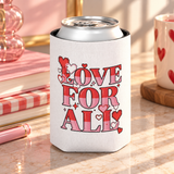 A white can cooler on a drink can, printed with "LOVE FOR ALL" in striped red and pink block lettering with pixel-style hearts and sparkles.