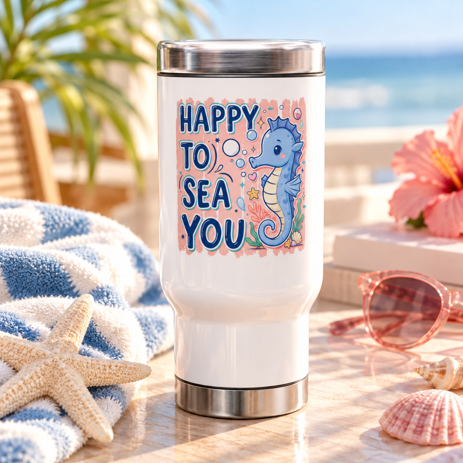 A white stainless steel travel mug with a silver lid and base, printed with "HAPPY TO SEA YOU" in navy lettering beside a smiling blue seahorse with bubbles, coral and a shell on a peach background.