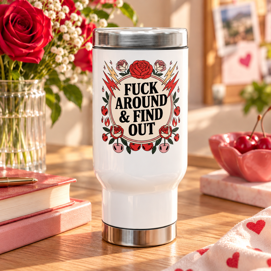 A white stainless steel travel mug with a silver lid and base, printed with a cheeky adult slogan ending "& FIND OUT" in bold black lettering on a cream circle, ringed by red roses, lightning bolts, flames and cherries.