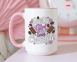A white ceramic mug with a colored handle and interior, printed with "Just a Girl who Loves Chocolate" in white and purple lettering with chocolate bars, cocoa beans and purple hearts.