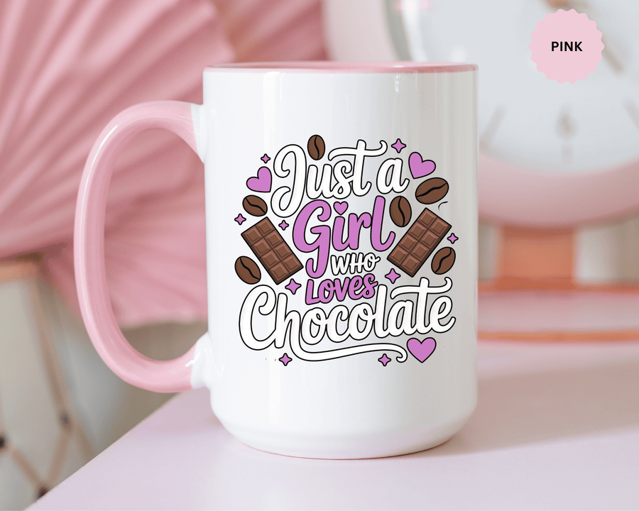 A white ceramic mug with a colored handle and interior, printed with "Just a Girl who Loves Chocolate" in white and purple lettering with chocolate bars, cocoa beans and purple hearts.