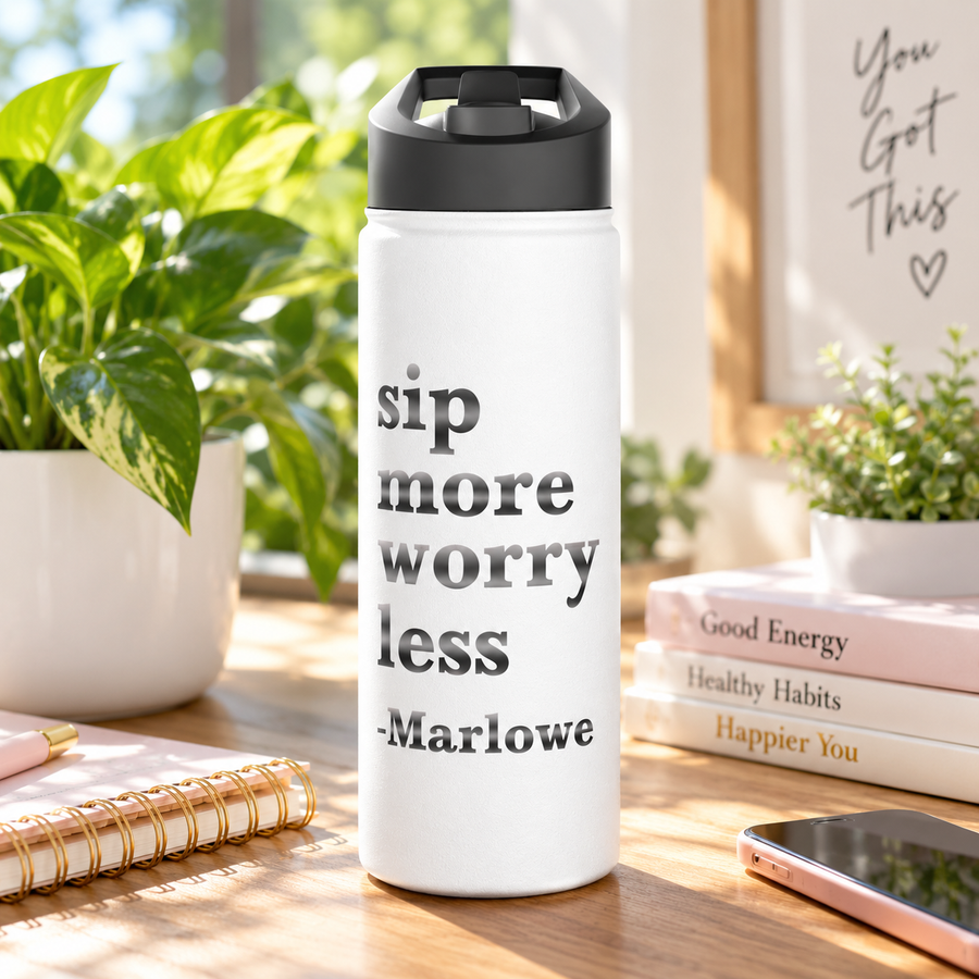 A white stainless steel water bottle with a black flip-top lid, printed with "sip more worry less" in large gray and black serif lettering above the sample name "-Marlowe".