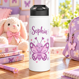 A white stainless steel water bottle with a black flip-top lid, printed with the sample name "Sophia" in purple script above a smiling purple and pink butterfly with heart antennae, surrounded by small pink hearts and flowers.