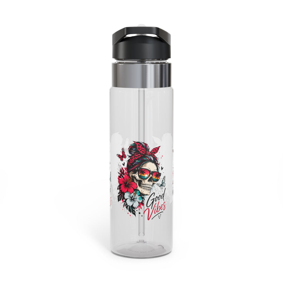 A clear water bottle with a black screw-on lid, stainless band and straw, printed with a skull wearing a red bandana and sunset sunglasses among red and white hibiscus flowers and butterflies, with "Good Vibes" in script.