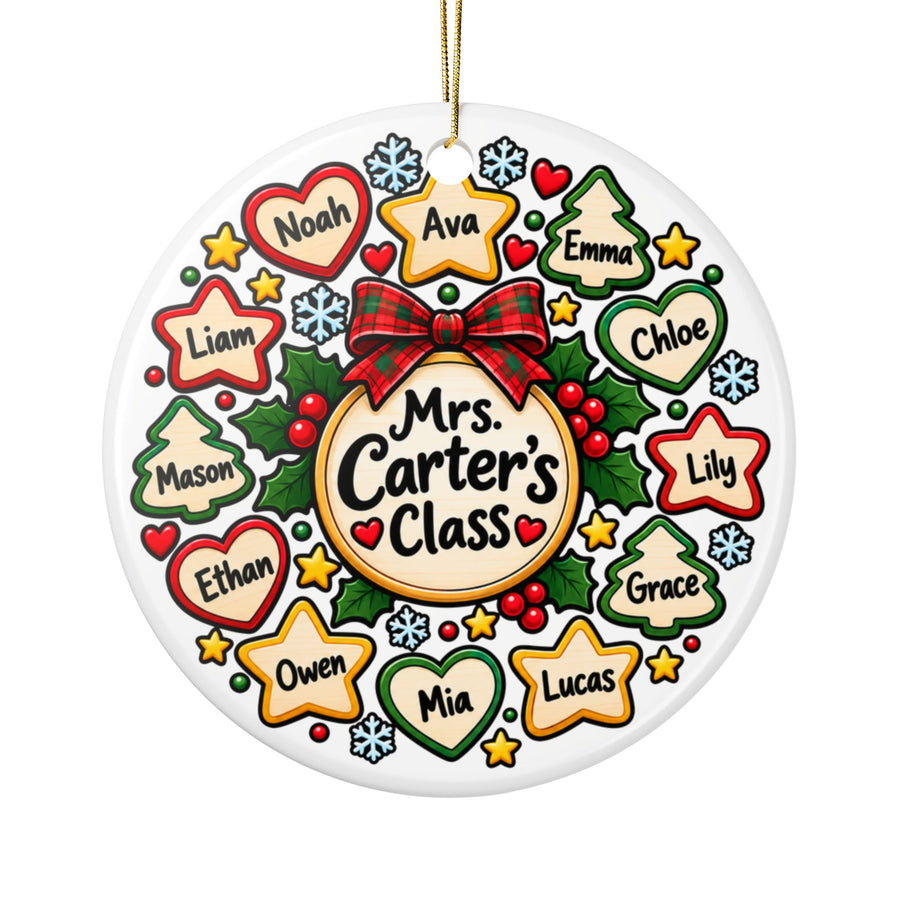 A round white ceramic Christmas ornament on a gold string, printed with a red plaid bow over a circle reading a sample "Mrs. Carter's Class", ringed by heart, star and tree-shaped tags with sample student names, holly, snowflakes and gold stars.