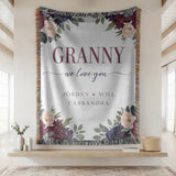 Grey fringed woven blanket with burgundy and blush peonies in the corners, reading Granny in tall letters above we love you in script and the names Jordan, Will and Cassandra.