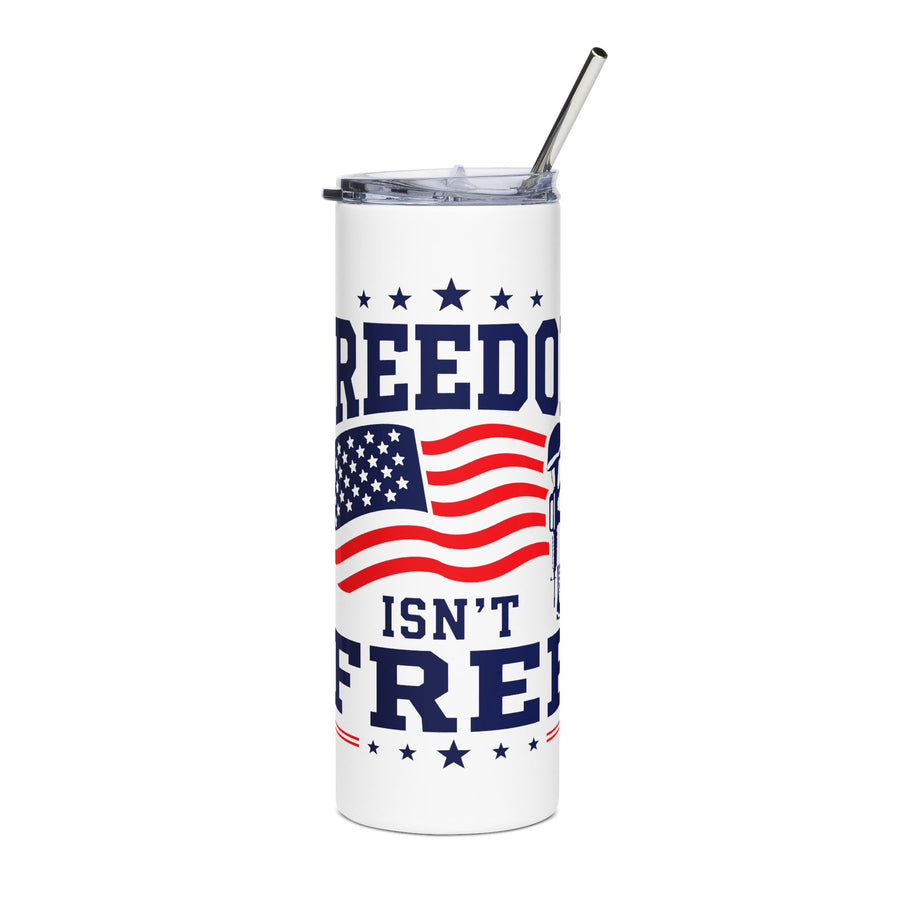 A white stainless steel skinny tumbler with a clear lid and metal straw, printed with "FREEDOM ISN'T FREE" in navy lettering around a waving American flag and a soldier's cross with helmet and boots.