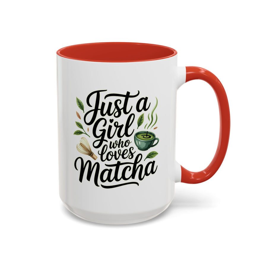 A white ceramic mug with a colored handle and interior, printed with "Just a Girl who loves Matcha" in black script with a green matcha cup, a bamboo whisk and tea leaves.