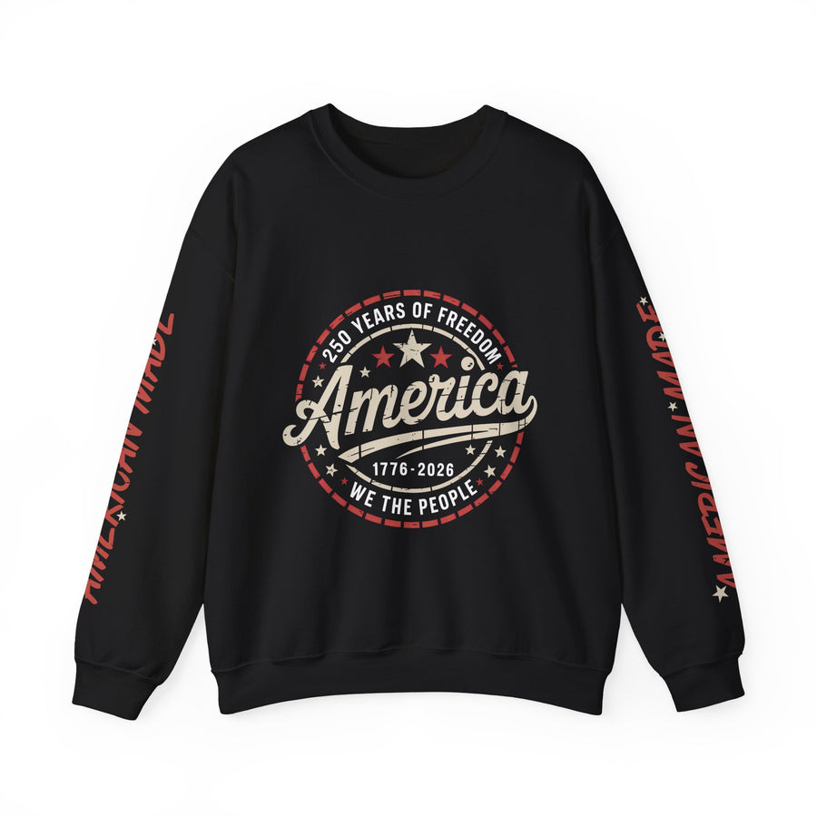 A black crewneck sweatshirt printed with a circular emblem reading 250 Years of Freedom, America, 1776-2026, We The People, with American Made on both sleeves.