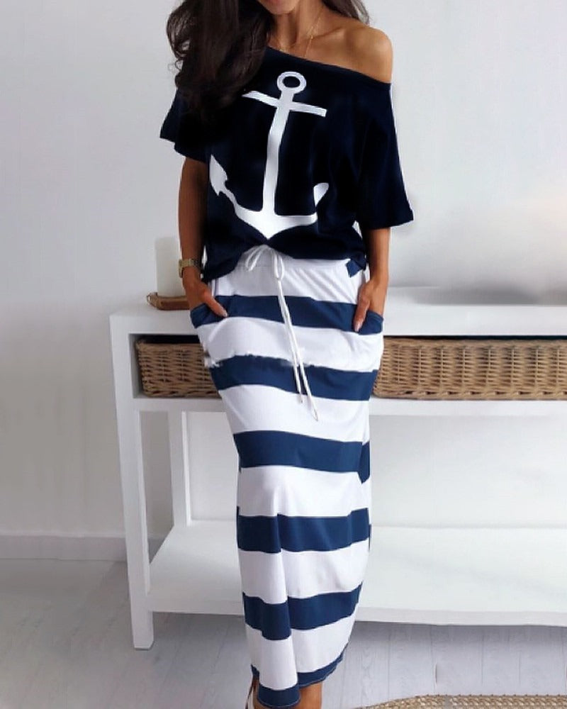 A navy short-sleeve T-shirt printed with a white anchor and the word hope, paired with a navy and white striped skirt.