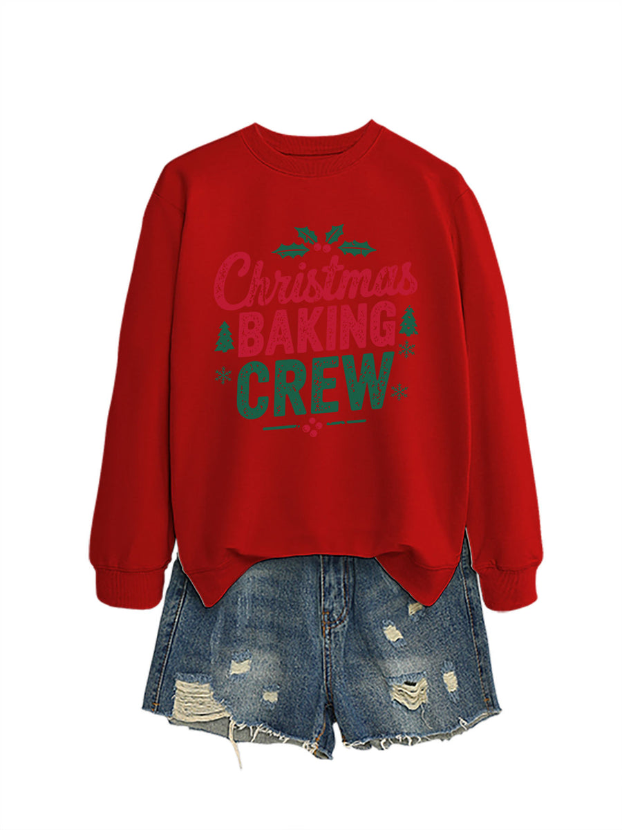 A black crewneck sweatshirt printed with Christmas Baking Crew in red and green lettering with holly.