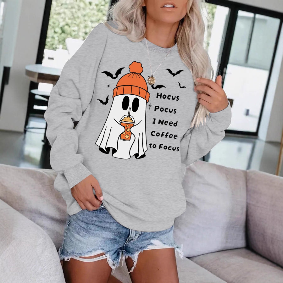 A gray crewneck sweatshirt printed with a cartoon ghost in an orange beanie holding a coffee cup, surrounded by bats and a coffee pun in black lettering.