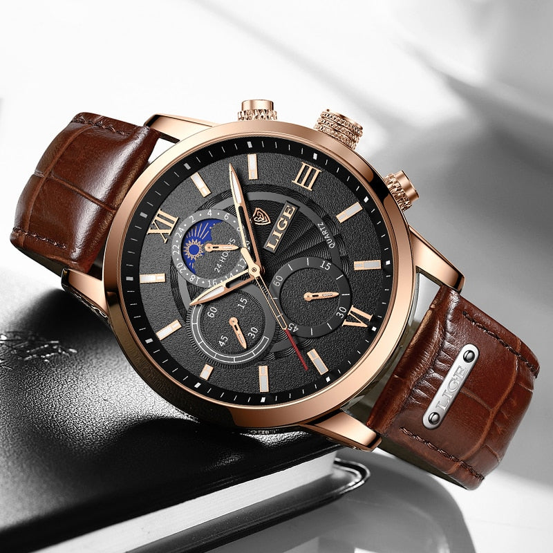 Rose gold chronograph watch with brown leather band and moon-phase dial, worn on wrist
