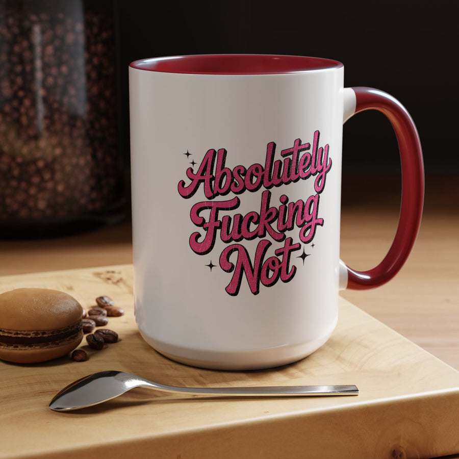 A white ceramic mug with a colored handle and interior, printed with "Absolutely" and "Not" in bold pink retro script with a cheeky extra word between them and small sparkles.