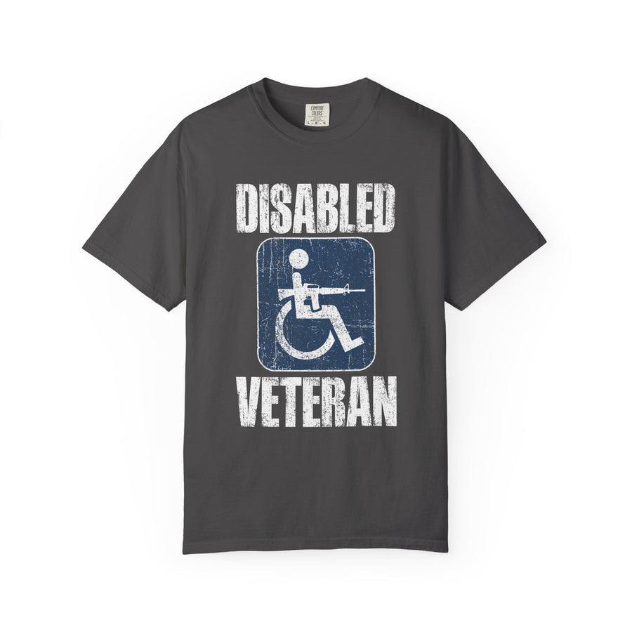 A red T-shirt printed with a distressed accessibility-symbol figure holding a rifle between Disabled and Veteran.