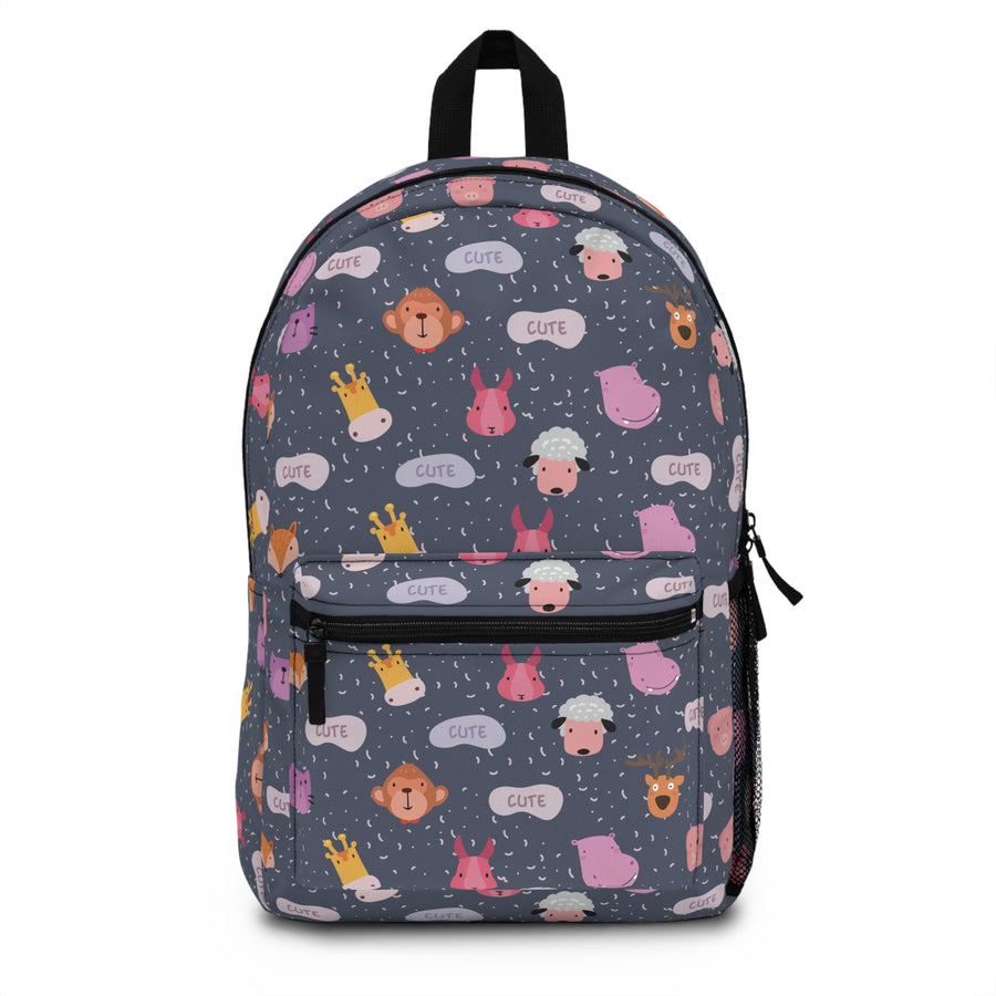 A backpack with black top handle, front zip pocket and mesh side pocket, covered in cartoon animal faces, including monkeys, sheep, bunnies, hippos and giraffes, with "CUTE" speech bubbles on a navy background.